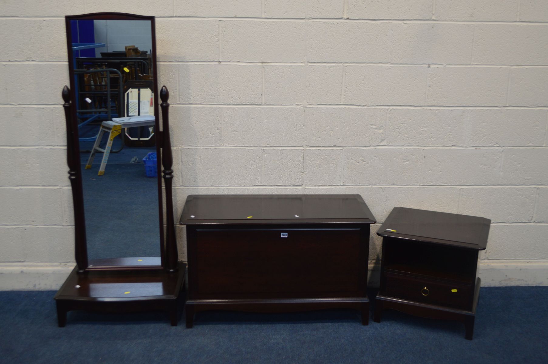 THREE VARIOUS STAG MINSTREL BEDROOM FURNITURE, to include a cheval mirror, blanket chest and a