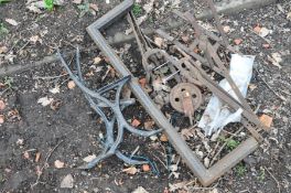 A QUANTITY OF METALWARE to include a pair of black painted cast iron bench ends, wrought iron