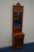 A SLIM REPRODUCTION CHERRYWOOD HALL STAND, with two hooks, bevelled mirror, single drawer and