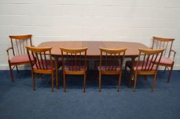 A MCINTOSH TEAK EXTENDING DINING TABLE, with a single fold out leaf, on cylindrical tapering legs,