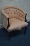 AN EDWARDIAN MAHOGANY TUB CHAIR with pink upholstery, on ceramic casters