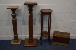 AN OAK TORCHERE STAND on a cylindrical and turned support, height 115cm, another torchere stand,