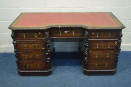 A LATE VICTORIAN CARVED POLLARD OAK AND OAK PEDESTAL DESK, burgundy leather and gilt tooled inlay,