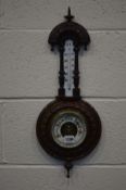 AN EDWARDIAN MAHOGANY ANEROID BAROMETER AND THERMONETER, height 57cm.