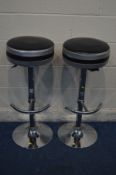 A PAIR OF CHROME FRAMED BAR STOOLS with adjustable height leaver and footstool