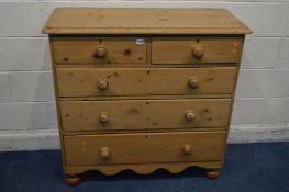 A VICTORIAN PINE CHEST OF TWO SHORT OVER THREE LONG GRADUATED DRAWERS, on bun feet, width 106cm x