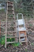 A SET OF WOODEN STEP LADDERS together with a similar smaller set, and two metal step ladders (4)