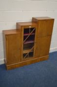 AN ART DECO WALNUT STEPPED BOOKCASE, with a fall front bureau section, two cupboard doors flanking a
