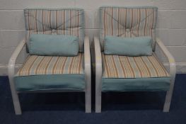 A PAIR OF CREAM METAL STRIPPED CUSHIONED ARMCHAIRS