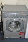 A HOTPOINT AQUARIUS WML 540 WASHING MACHINE (PAT pass and powers up) plastic plinth from bottom