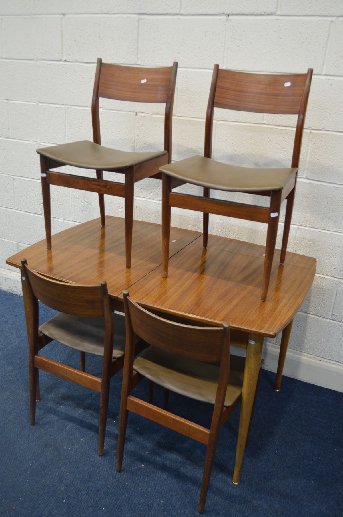 A 1950'S/60'S AFROMOSIA EXTENDING TABLE, with a single additional fold out leaf, extended length