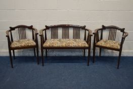 AN EDWARDIAN MAHOGANY THREE PIECE SALON SUITE, comprising a settee, width 108cm (repair to right