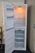 A BEKO TALL FRIDGE FREEZER (PAT pass and working at 4 and -18 degrees) 55cm wide and 182cm high