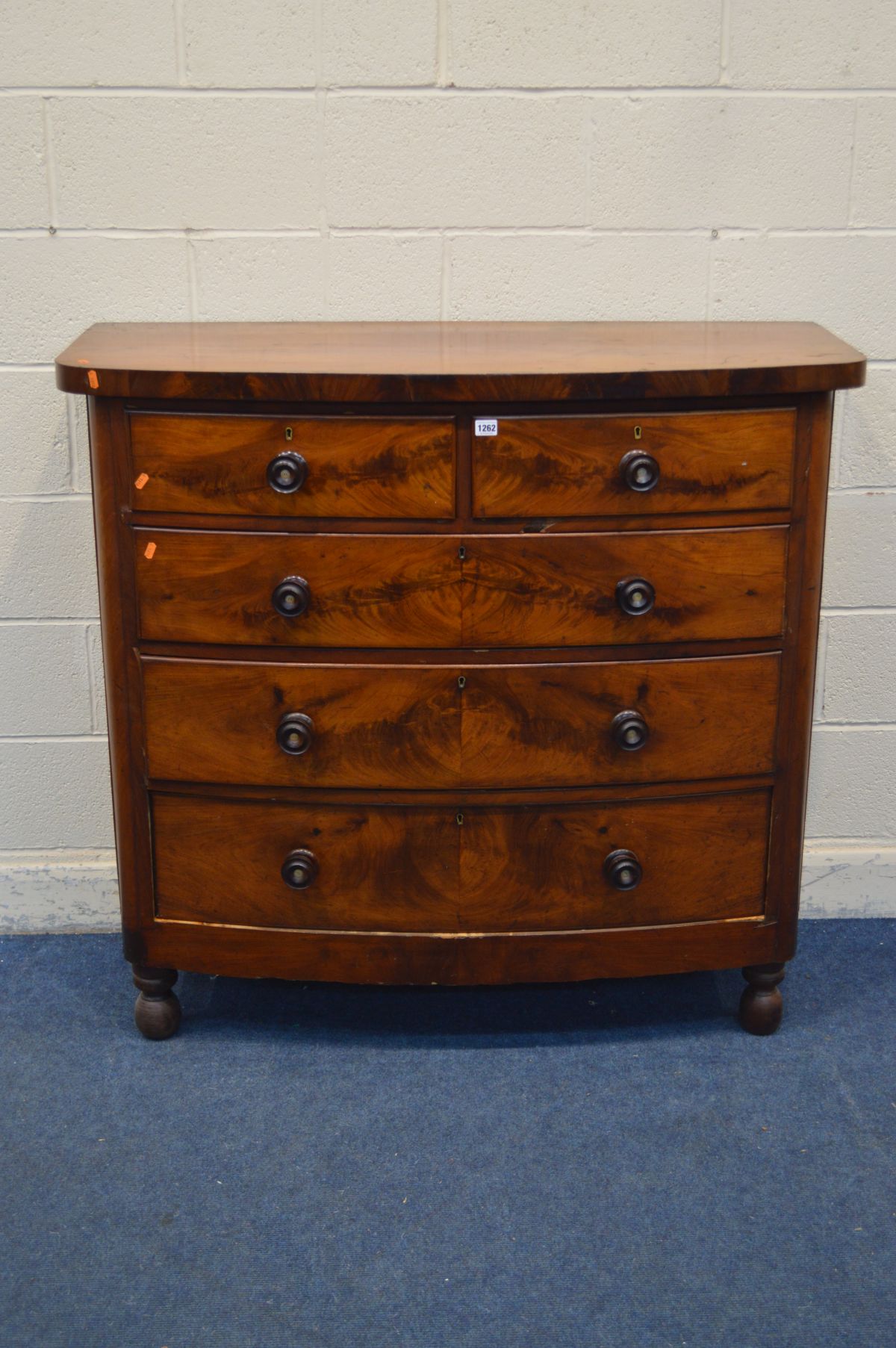 A GEORGIAN MAHOGANY CHEST OF TWO SHORT OVER THREE LONG DRAWERS, with turned handles and feet,