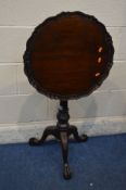 A REPRODUCTION MAHOGANY BIRDCAGE TILT TOP TRIPOD TABLE, in the Georgian style, with a wavy edge top,