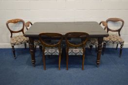 A DISTRESSED EDWARDIAN MAHOGANY DINING TABLE with two leaves (one leaf un-fittable and adapted and