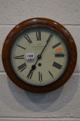 C BALMFORTH, OSWESTRY, AN EARLY 20TH CENTURY OAK CIRCULAR WALL CLOCK, white dial with roman