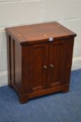 A DARK SOLID OAK TWO DOOR UNIT/CABINET, width 54cm x depth 38cm x height 62cm