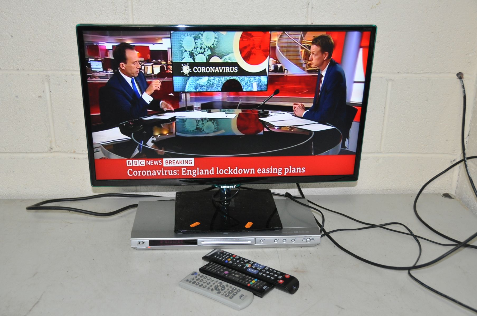 A SAMSUNG LT27D390SW 27ins tv with remote (working) and a JVC DVD player with remote (Doesn't read