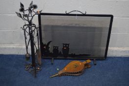 A DECORATIVE WROUGHT IRON FOUR PIECE COMPANION SET, with fruiting vine and flower heads
