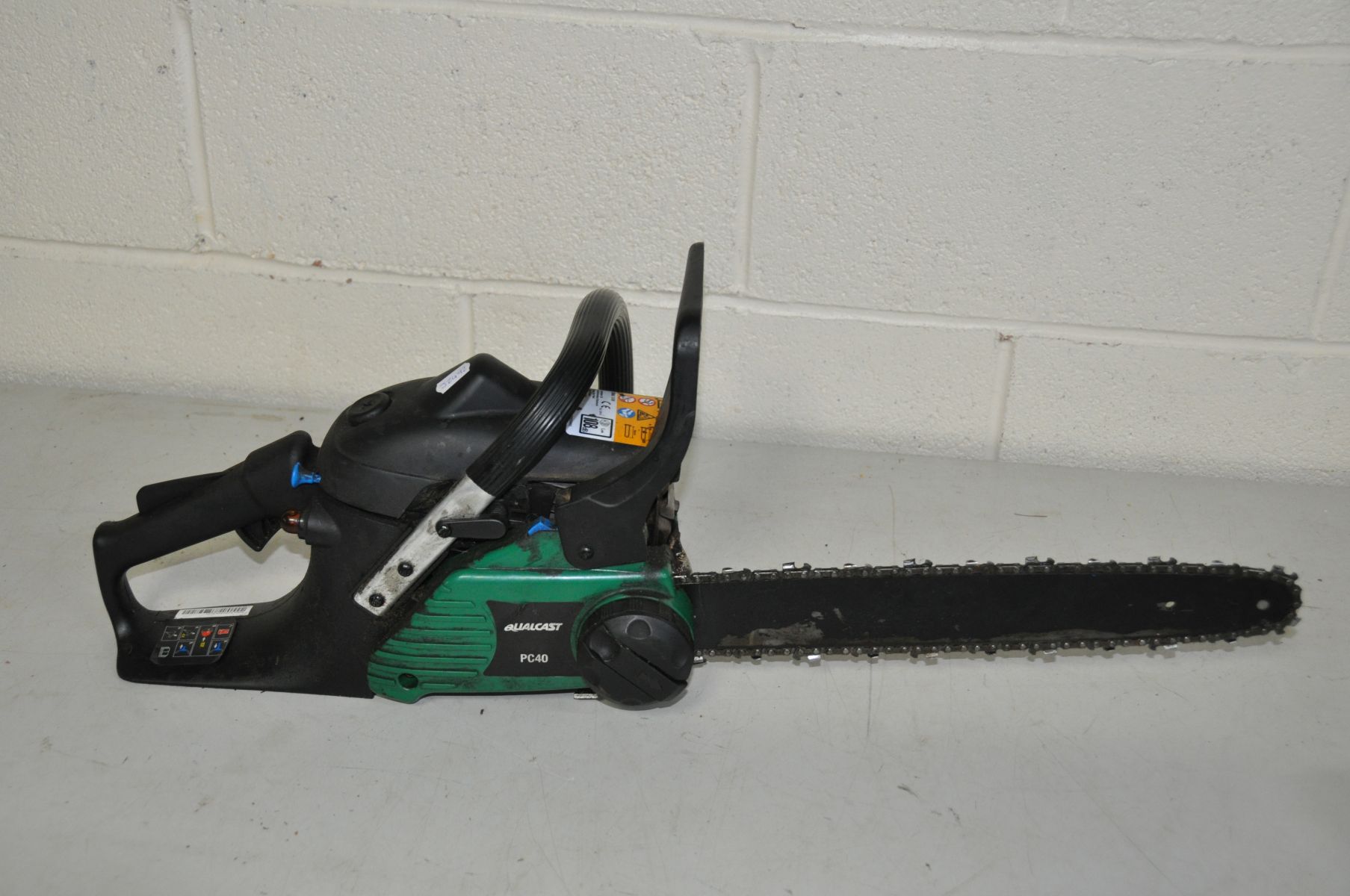 A QUALCAST PC40 PETROL CHAINSAW with 40cm cut ( engine pulls freely but hasn't been started)