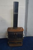 A LOG BURNER STYLE GAS FIRE width 44cm x depth 32cm and 117cm to top of flue