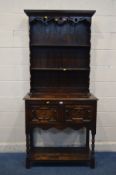 A SLIM EARLY TO MID 20TH CENTURY OAK DRESSER, with geometric detail, two tier plate rack, two
