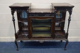 AN EDWARDIAN MAHOGANY MIRRORBACK DISPLAY CABINET, foliate decoration, with a central glazed door, on