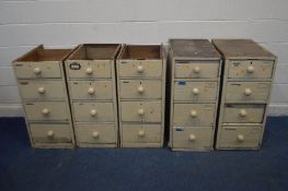 FIVE VARIOUS VINTAGE PAINTED PINE BANK OF FOUR DRAWERS, with turned handles, three with no tops,
