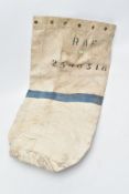 A POST WWII WHITE CANVAS KIT BAG issued by the R.A.F. Blue stripe across centre with service/