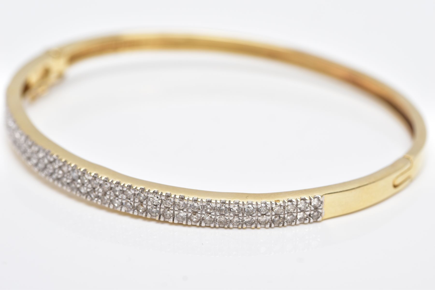 A YELLOW METAL DIAMOND BANGLE, the hinged bangle designed with two rows of round brilliant cut - Image 3 of 6