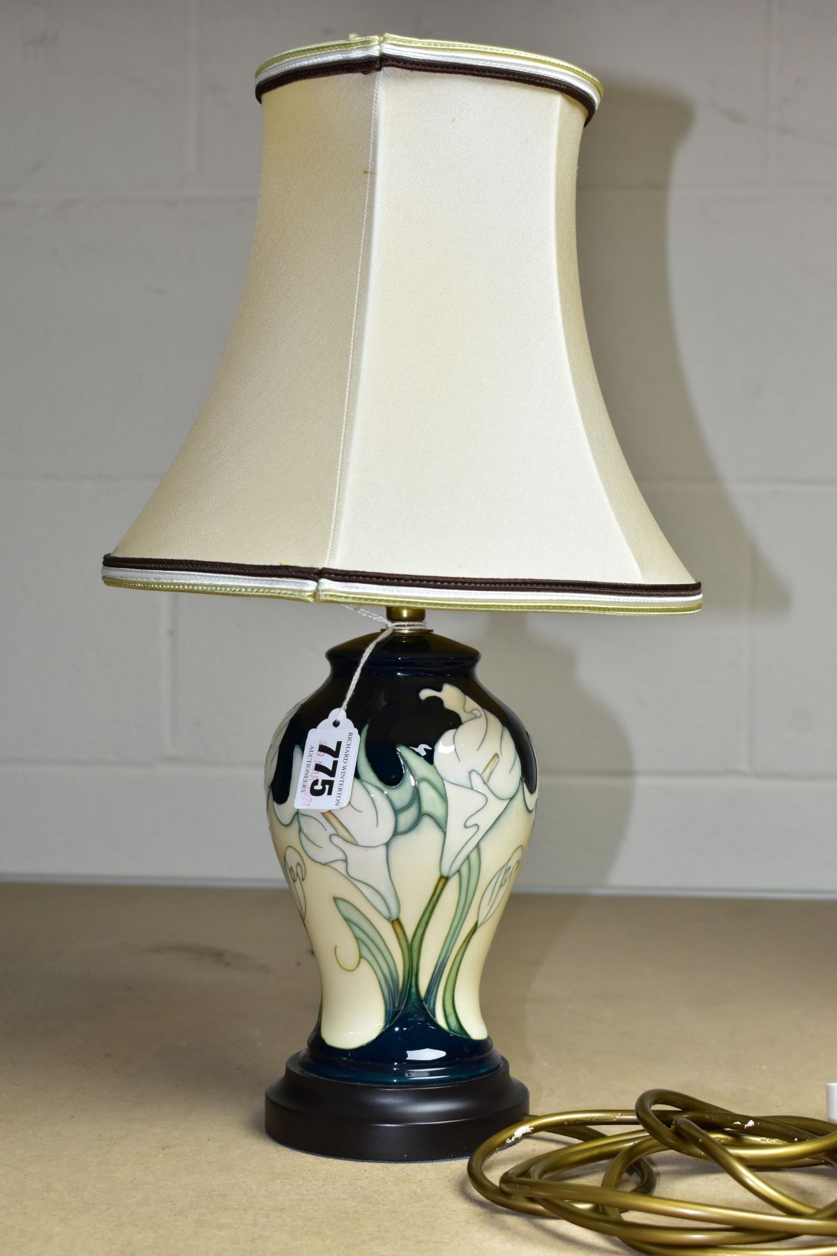 A MOORCROFT TABLE LAMP WITH SHADE, decorated with white Cala Lilys against a cream and green ground,