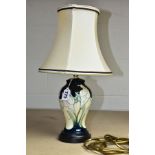 A MOORCROFT TABLE LAMP WITH SHADE, decorated with white Cala Lilys against a cream and green ground,