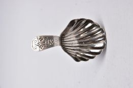 A GEORGE III SILVER CADDY SPOON, shell shaped bowl, decorative floral handle, bright cut and