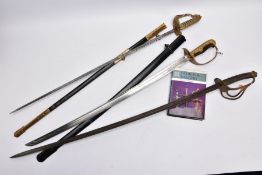 A GEO V ROYAL NAVAL DRESS SWORD with leather and metal scabbard, ray skin grip with lions head