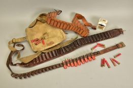 AN EX MILITARY CANVAS HAVERSACK containing three 12 bore shotgun belts 14.4 x .410'' x 2½''