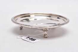 A SILVER DISH, of a circular form, plain polished design, raised on three scroll feet, hallmarked '