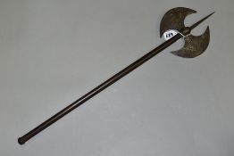 AN ANTIQUE ISLAMIC PERSIAN DOUBLE HEADED AXE, etched decoration, metal shaft, length 66.5cm