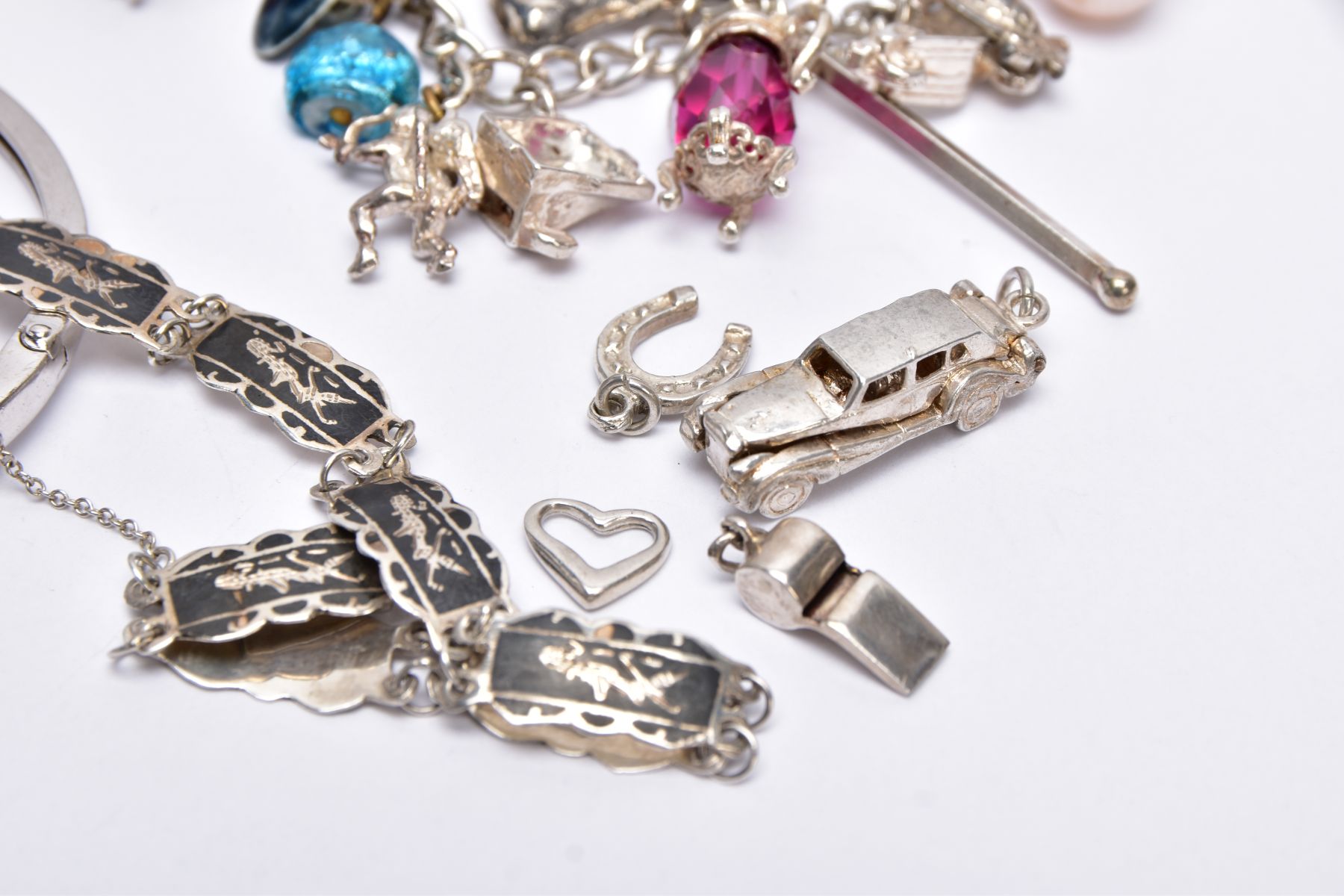A BAG OF ASSORTED JEWELLERY, to include three white metal charm bracelets suspending charms, one - Image 3 of 7