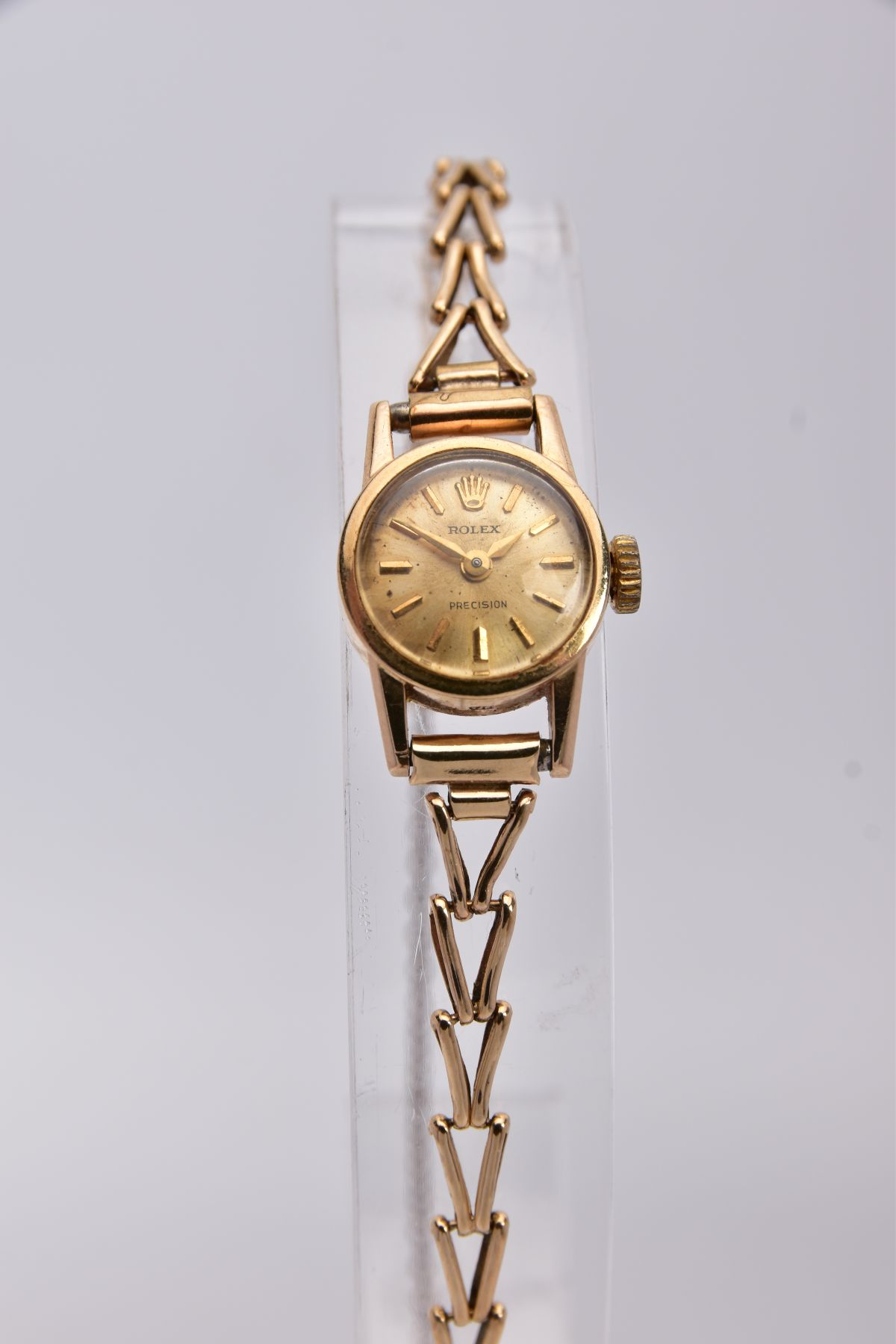 A LADIES 9CT GOLD ROLEX PRECISION WRISTWATCH, round case measuring approximately 16mm in diameter,