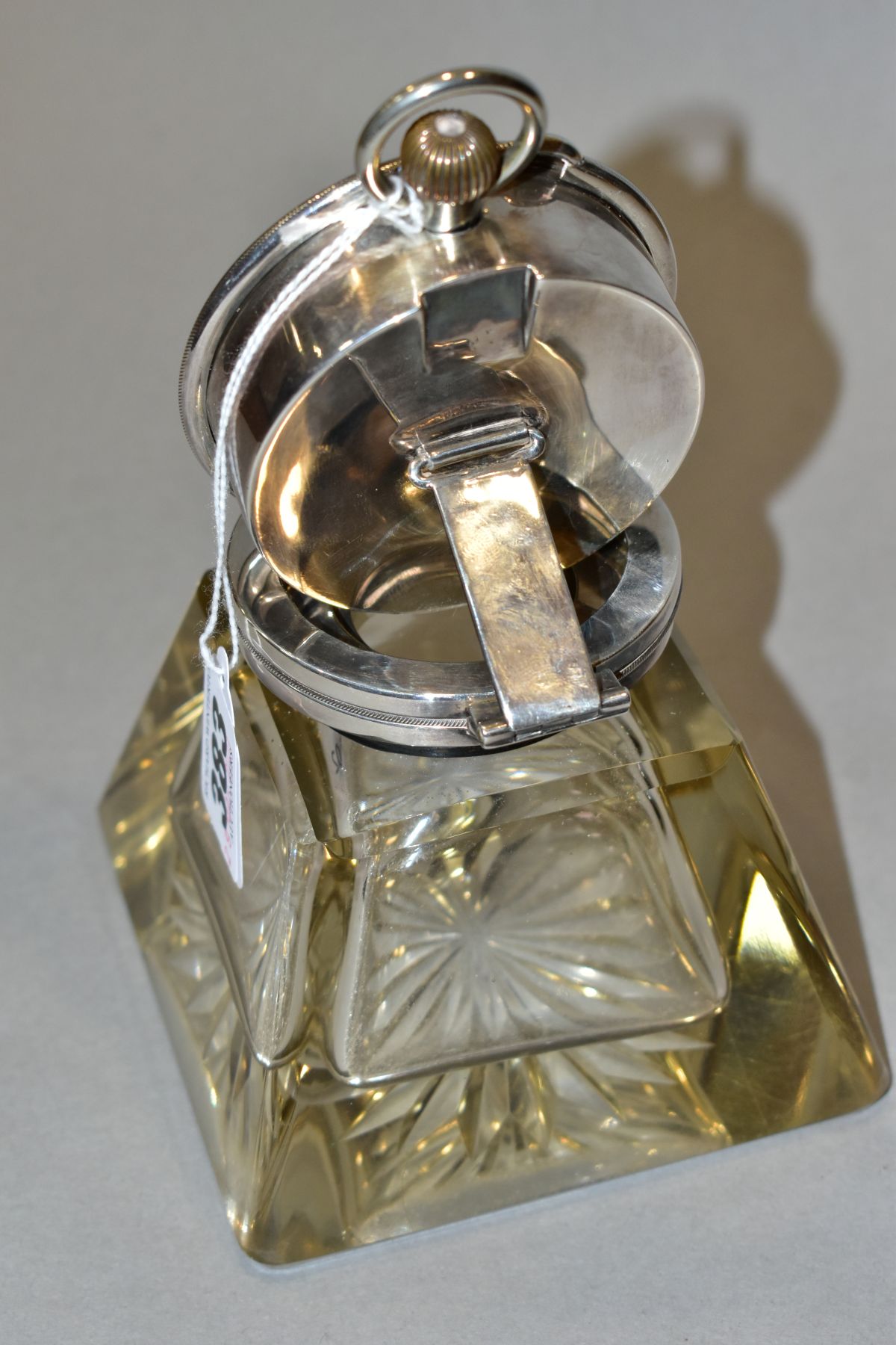 AN EDWARDIAN SILVER MOUNTED GLASS INKWELL/GOLIATH POCKET WATCH STAND, circa 1906, the hinged cover - Image 8 of 10