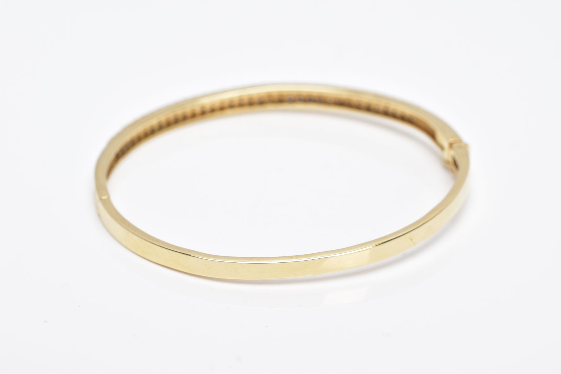 A YELLOW METAL DIAMOND BANGLE, the hinged bangle designed with two rows of round brilliant cut - Image 4 of 6