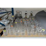 A QUANTITY OF CUT GLASS to include brandy balloons, whisky tumblers, sherry glasses, wine glasses,