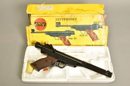 A .177'' MODEL 6 AIR PISTOL serial number 19168 in its origin packaging (the cover of which is badly