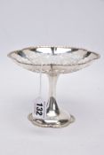 A SILVER PIERCED DISH, circular form with a decorative foliate rim, openwork scroll pierced