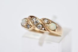 A 9CT GOLD OPAL RING, of a crossover design, set with five circular cut colourless cubic zirconia