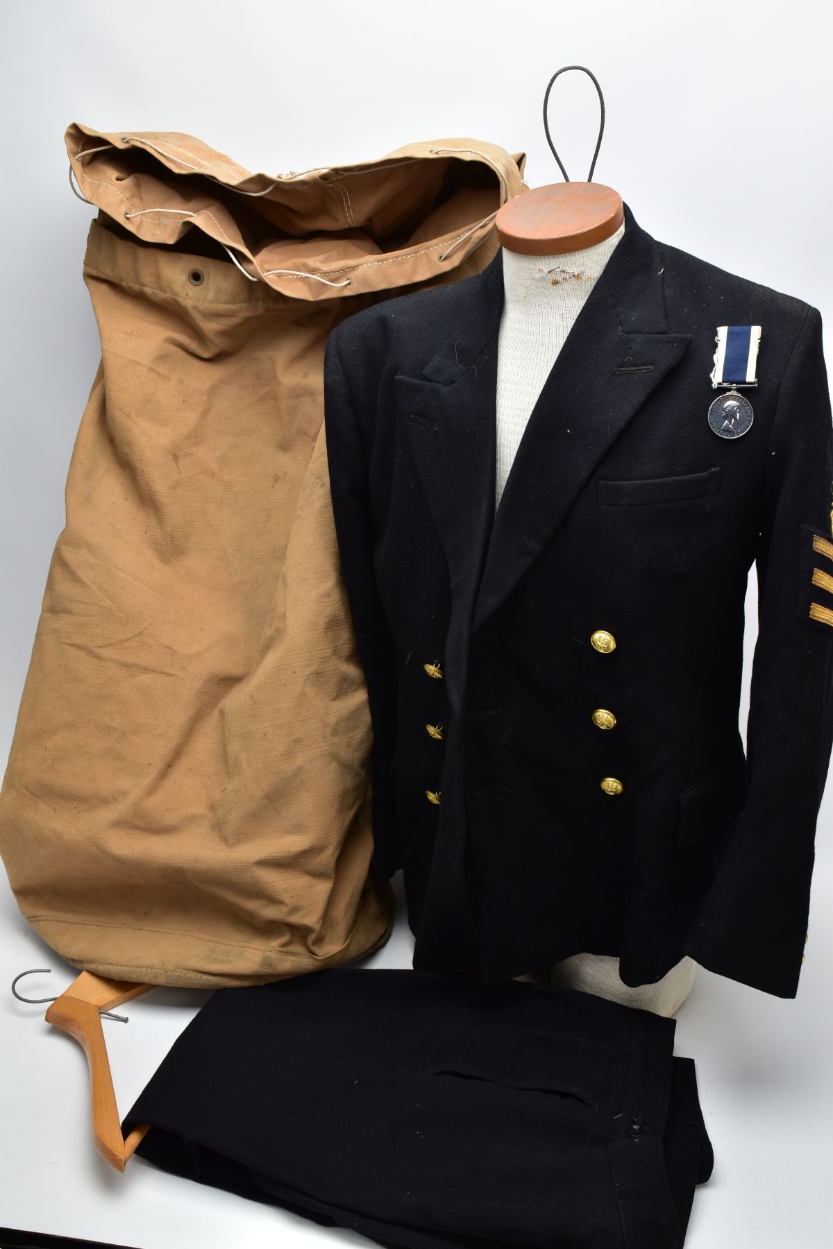 A ROYAL NAVY DRESS UNIFORM JACKET AND TROUSERS, with Rank & Crown patch to left sleeve and AL