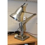 A VINTAGE HERBERT TERRY ANGLEPOISE LAMP, polished aluminium finish, on a stepped square base, not