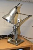 A VINTAGE HERBERT TERRY ANGLEPOISE LAMP, polished aluminium finish, on a stepped square base, not