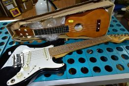 A CHILD SIZE CRUISER BY CRAFTER ELECTRIC GUITAR, together with a boxed 'Vintage' plastic ukulele (